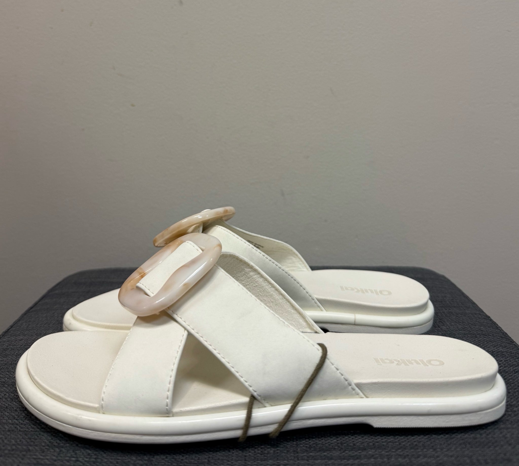 7 OLUKAI Cream Sandals