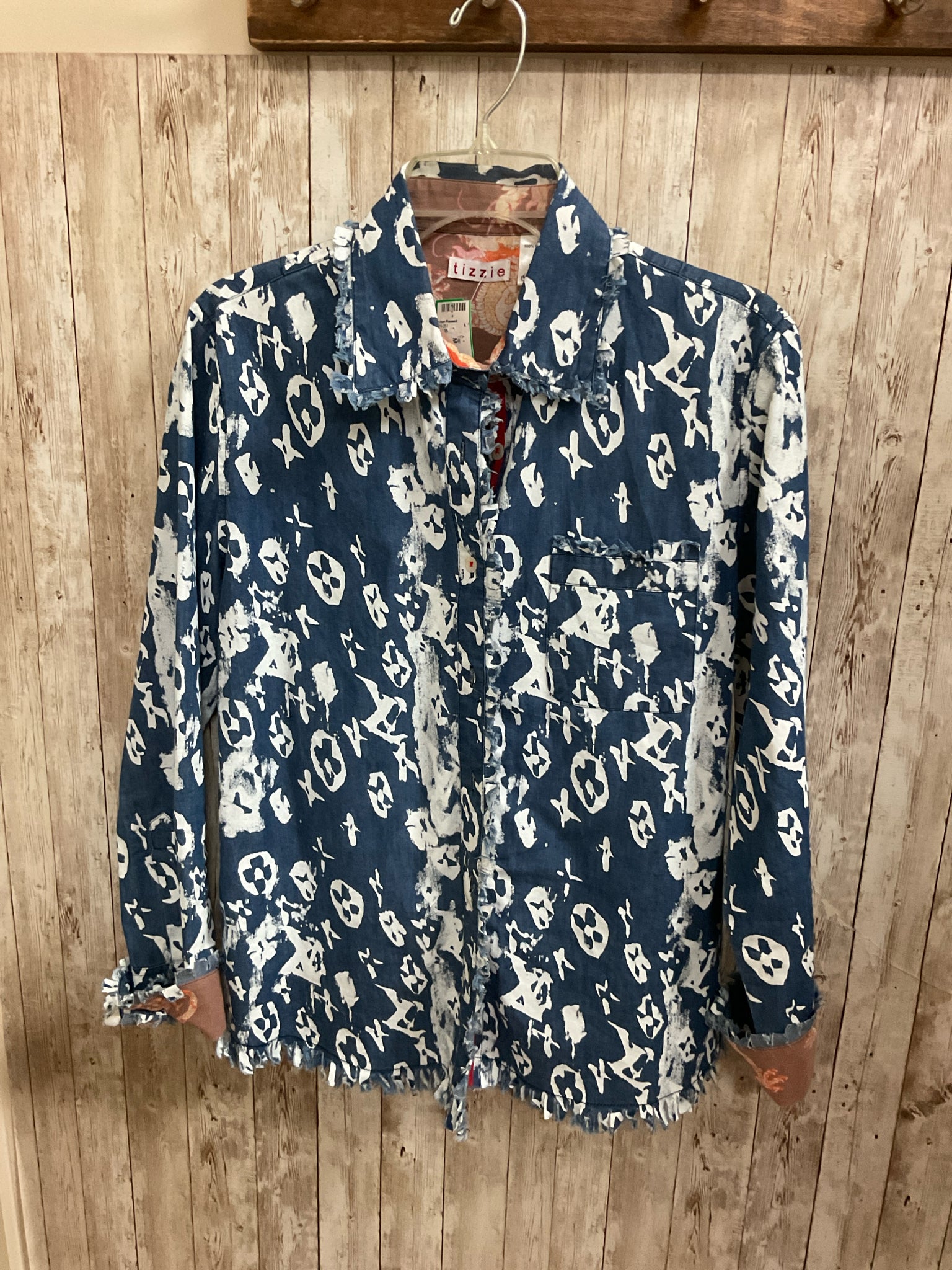 Size M TIZZIE BLUE AND WHITE FLORAL Top