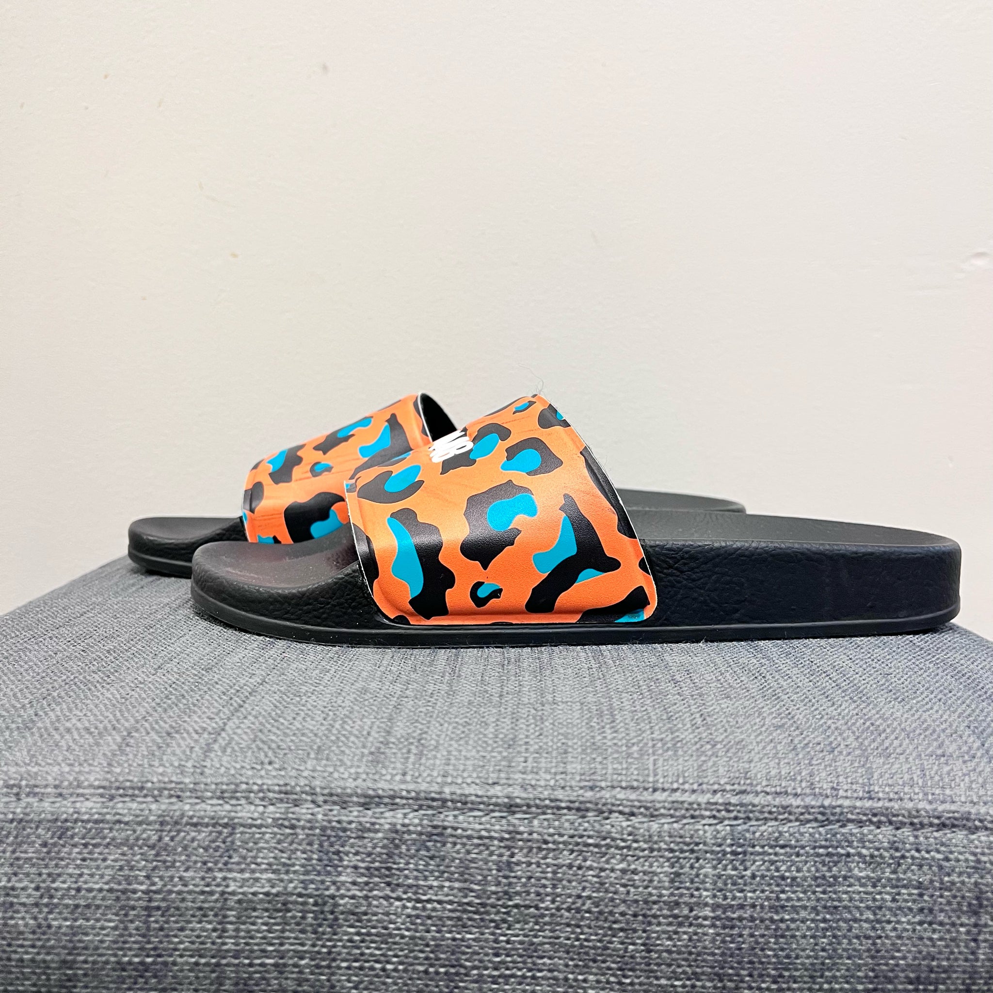 P 448 7 ORANGE AND BLACK FLIP FLOP