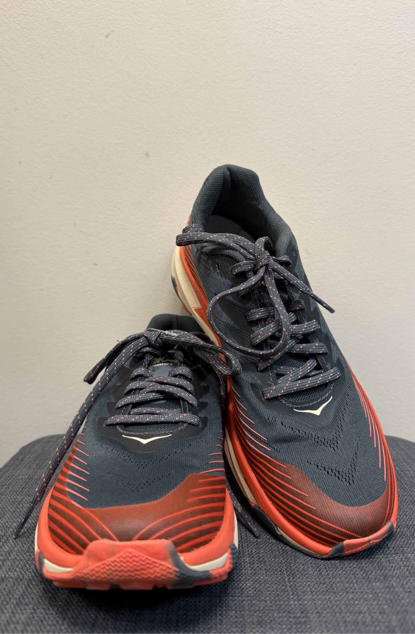 9 HOKA GREY AND ORANGE SHOES