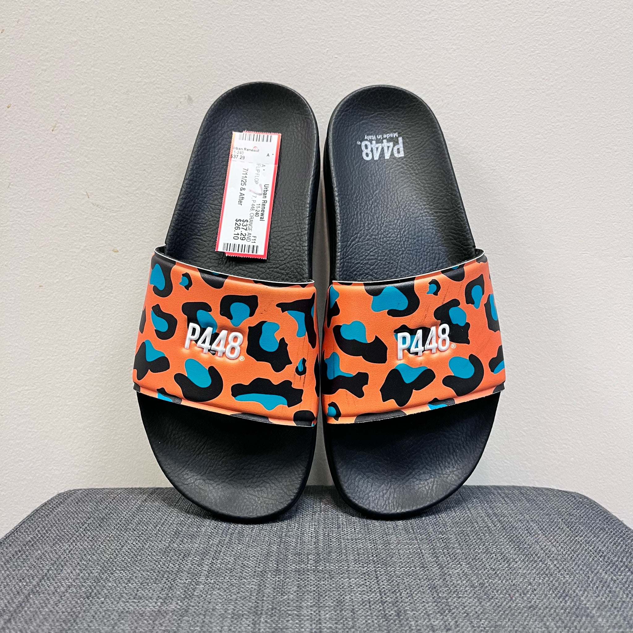 P 448 7 ORANGE AND BLACK FLIP FLOP